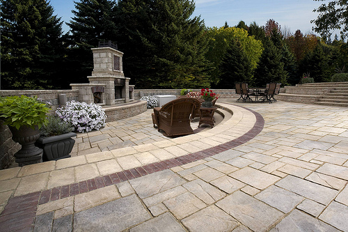 Unilock's Avante Ashlar and Copthorne Banding with Tuscany Fireplace